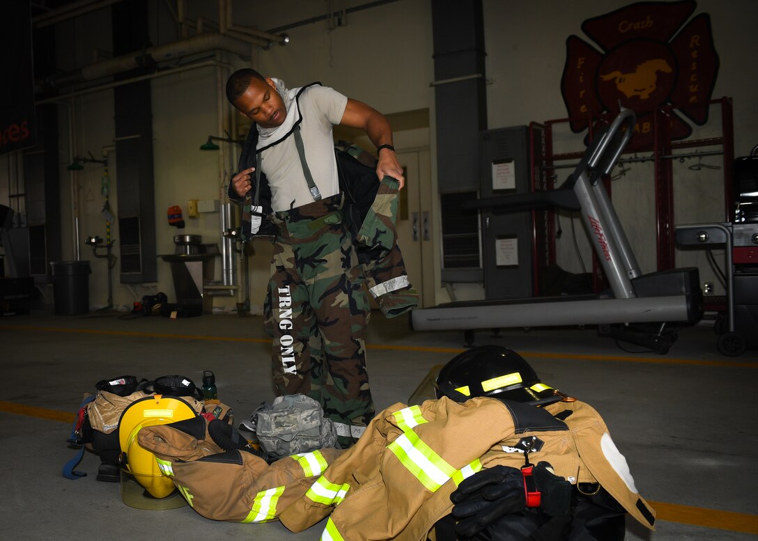 U.S. and Republic of Korea Air Force firefighters work together to put out a fire during a training exercise on Osan Air Base, Republic of Korea, March 26, 2018.