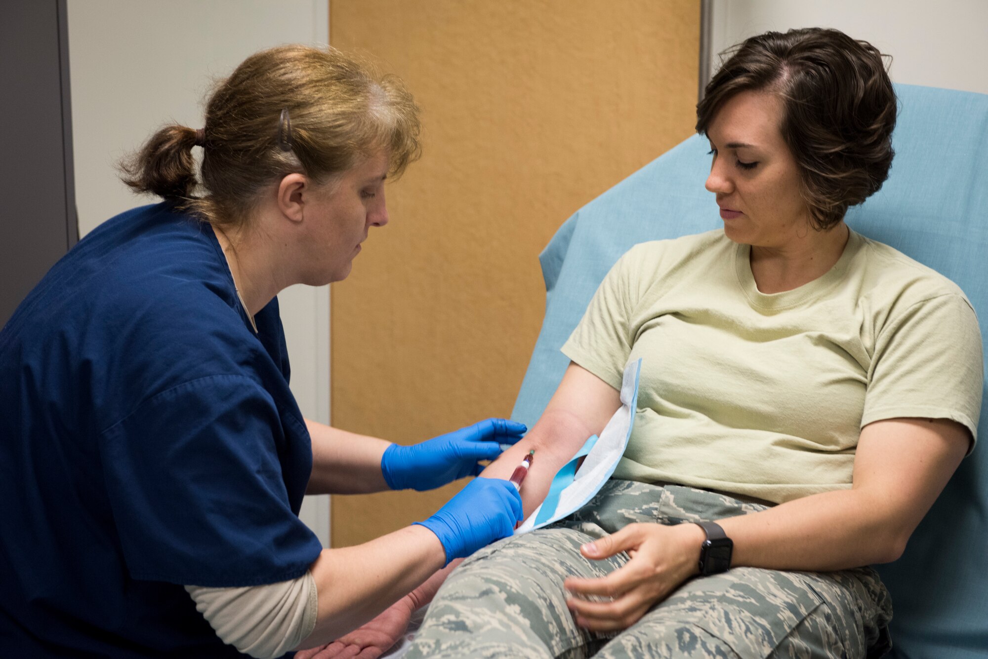 2nd Lt. Tera Hammond, 374th Medical Group clinical nurse and simulated patient, is prepped for an IV during helicopter patient transport training, March 30, 2018, at Yokota Air Base, Japan.