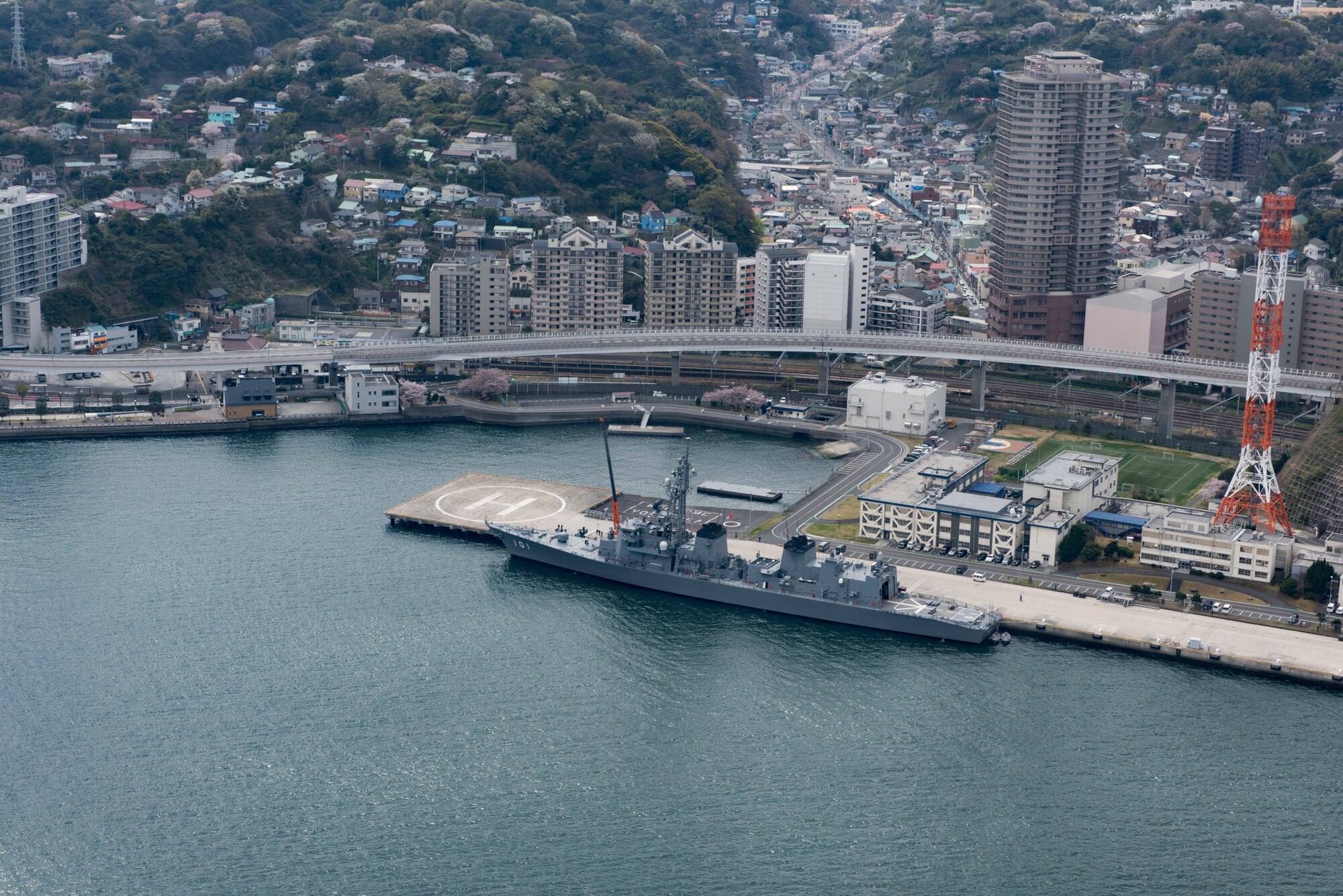 A ship docked near a helicopter landing pad, March 30, 2018, at U.S. Fleet Activities Yokosuka, Japan.