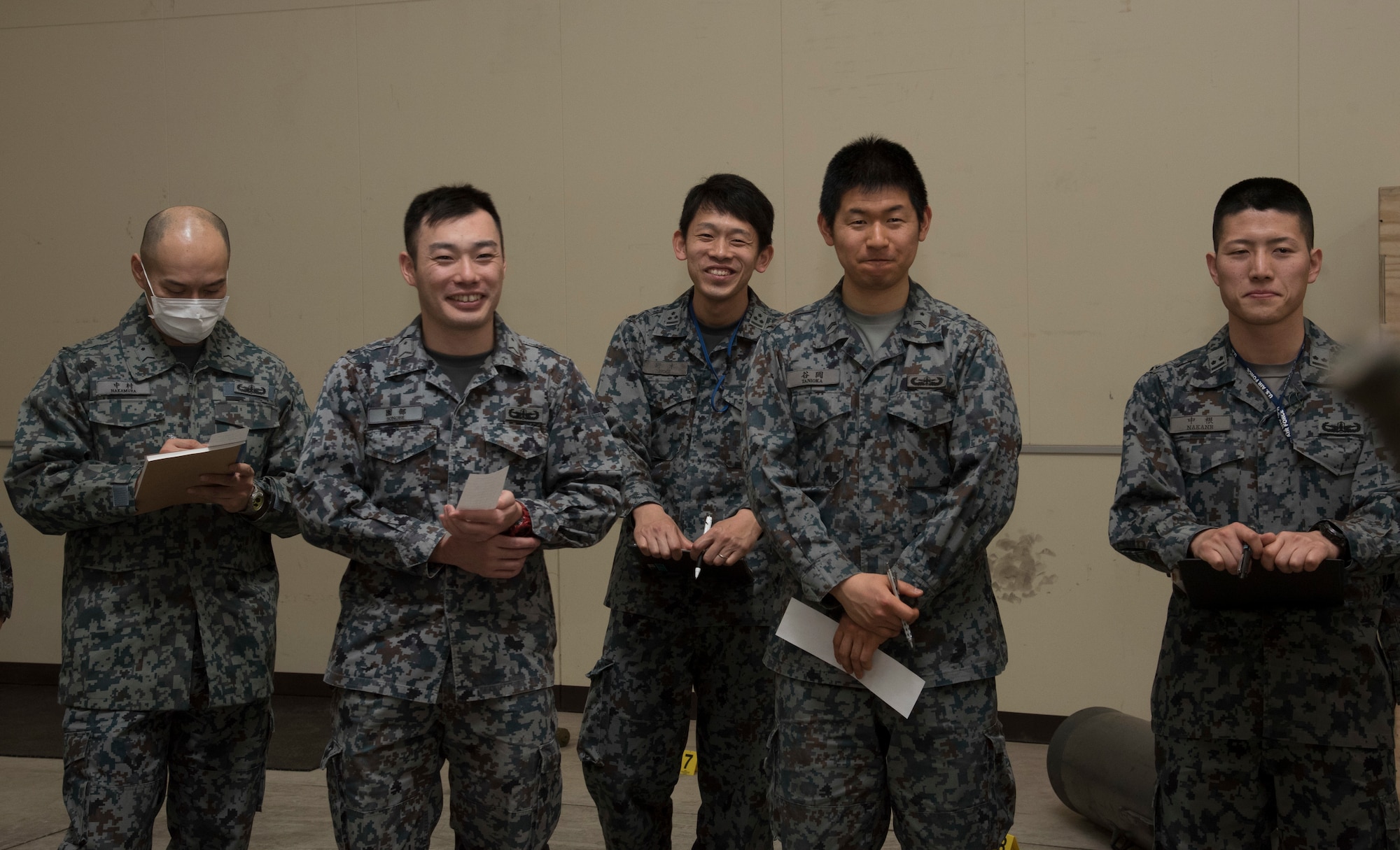 Japan Air Self-Defense Force 3rd Air Wing weapons maintenance technicians and Tohoku Sub
Base, Tohoku, Japan, explosive ordnance disposal instructors, listen to an explanation of an
ordnance during an EOD training course at Misawa Air Base, Japan, March 29, 2018. A group of
11 members came to enhance their knowledge on various ordnances as well as practice their
English-speaking skills for future bilateral missions. The class covered searching, identifying and
recovering unexploded ordnances. (U.S. Air Force photo by Senior Airman Sadie Colbert)