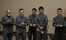 Japan Air Self-Defense Force 3rd Air Wing weapons maintenance technicians and Tohoku Sub
Base, Tohoku, Japan, explosive ordnance disposal instructors, listen to an explanation of an
ordnance during an EOD training course at Misawa Air Base, Japan, March 29, 2018. A group of
11 members came to enhance their knowledge on various ordnances as well as practice their
English-speaking skills for future bilateral missions. The class covered searching, identifying and
recovering unexploded ordnances. (U.S. Air Force photo by Senior Airman Sadie Colbert)