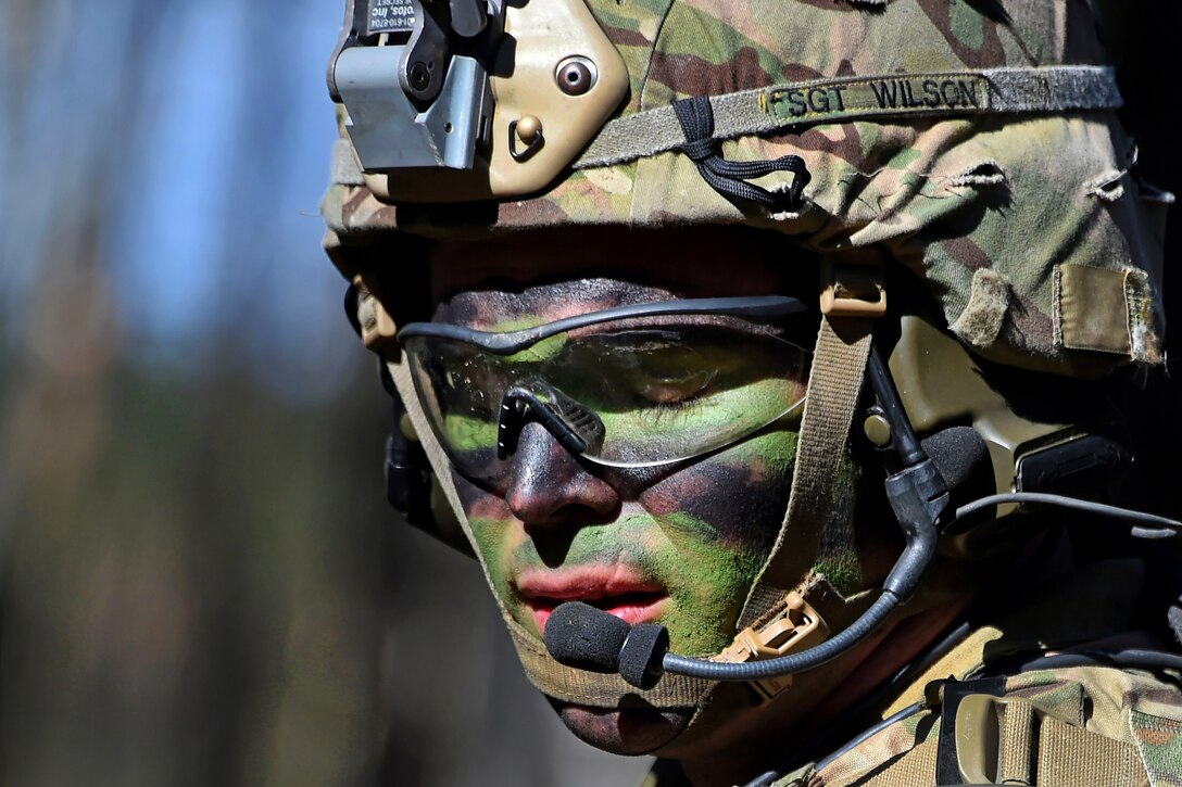 A soldier communicates with his headquarters leadership team.