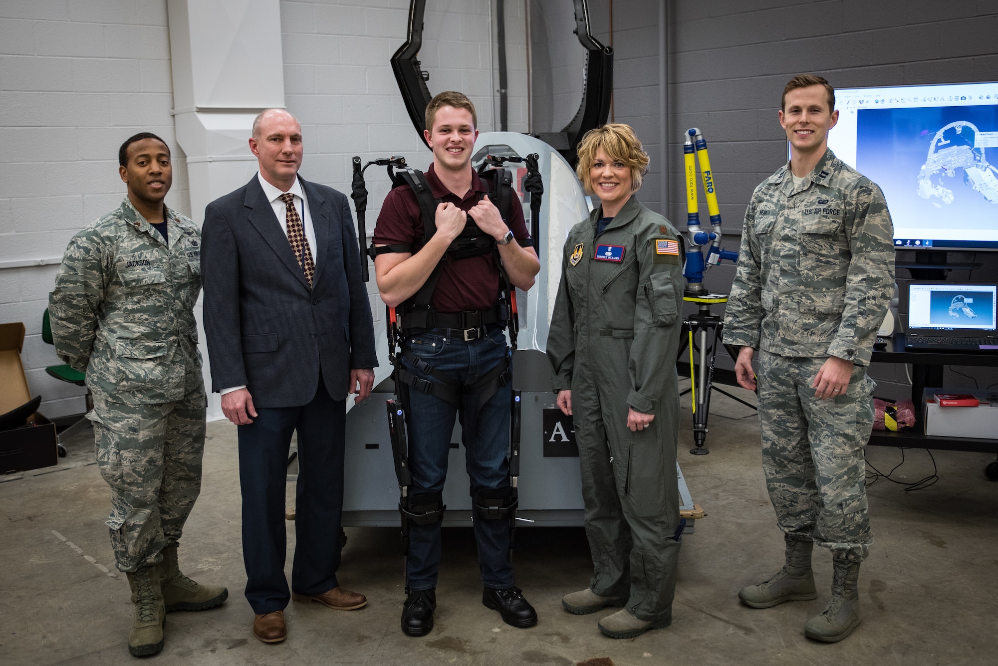 Maj. Shawnee Williams (second from right) stands with her team (from left) - Maj. Bryan Jackson, Dr. Daniel Mountjoy, Mr. Corey Shanahan, and Capt. Dan Neal - in the newly renovated anthropometry lab at the 711th Human Performance Wing's Human Systems Integration Directorate. (U.S. Air Force photo by Rick Eldridge)