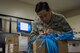 Staff Sgt. Justin Raymond Minimo, 374th Communications Squadron Operations Flight client systems technician craftsman, prepares an Ethernet cable for a clip at Yokota Air Base, Japan, April 4, 2018.