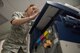 Senior Airman Amy Kristoffersen, 374th Communications Squadron Operations Flight client systems technician journeyman, verifies system setting prior to completing a printer swap at Yokota Air Base, Japan, April 4, 2018.