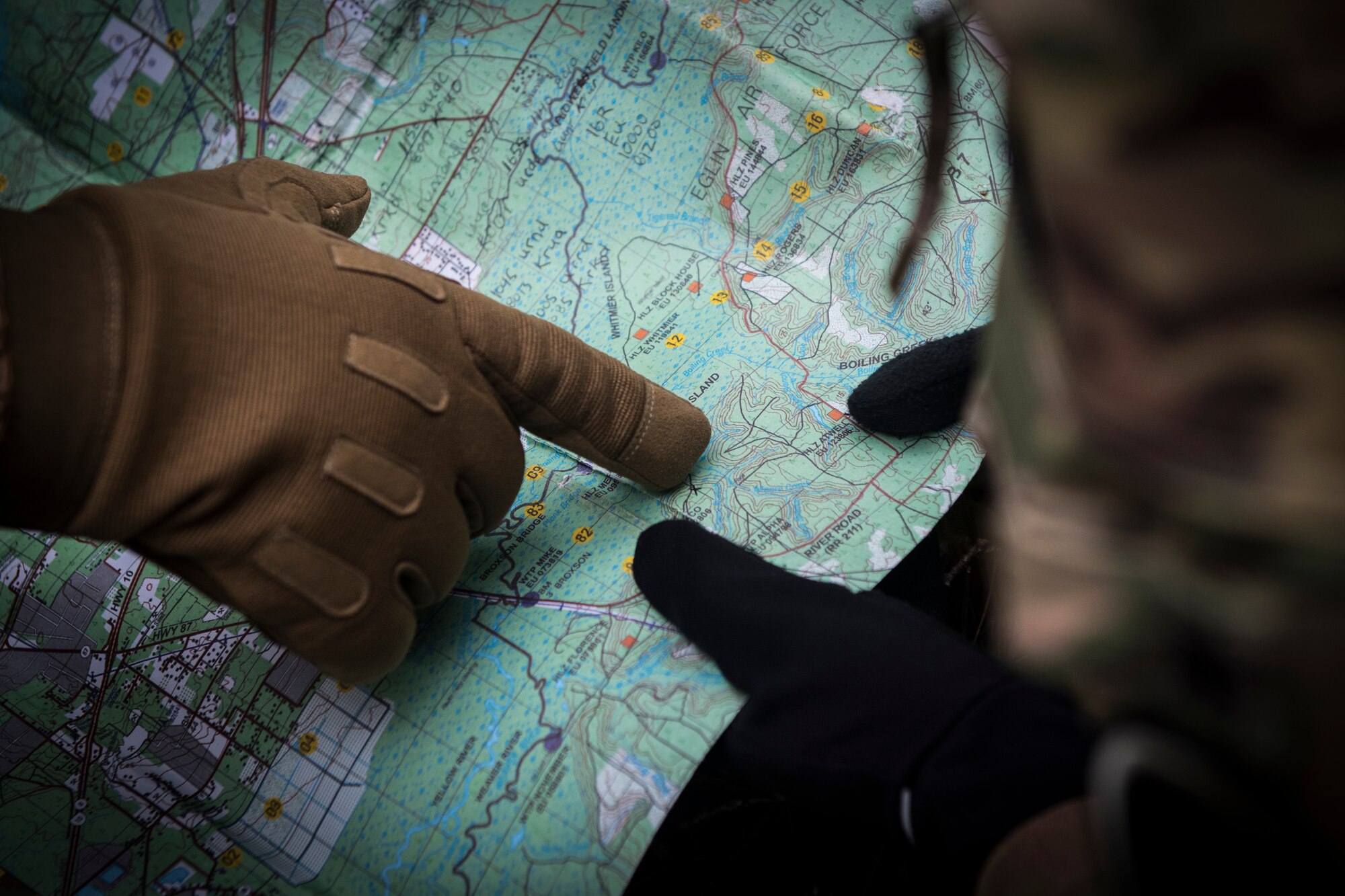 Aircrew members with the 1st Special Operations Wing evade opposing forces during combat survival training at the Eglin Range, Fla., Dec. 7, 2017. Aircrew members are required to attend survival, evasion, resistance and escape CST as a refresher every 36 months to ensure that vital skill sets are maintained in case they survive a crash or have to ditch their aircraft, potentially behind enemy lines. (U.S. Air Force photo by Senior Airman Joseph Pick)