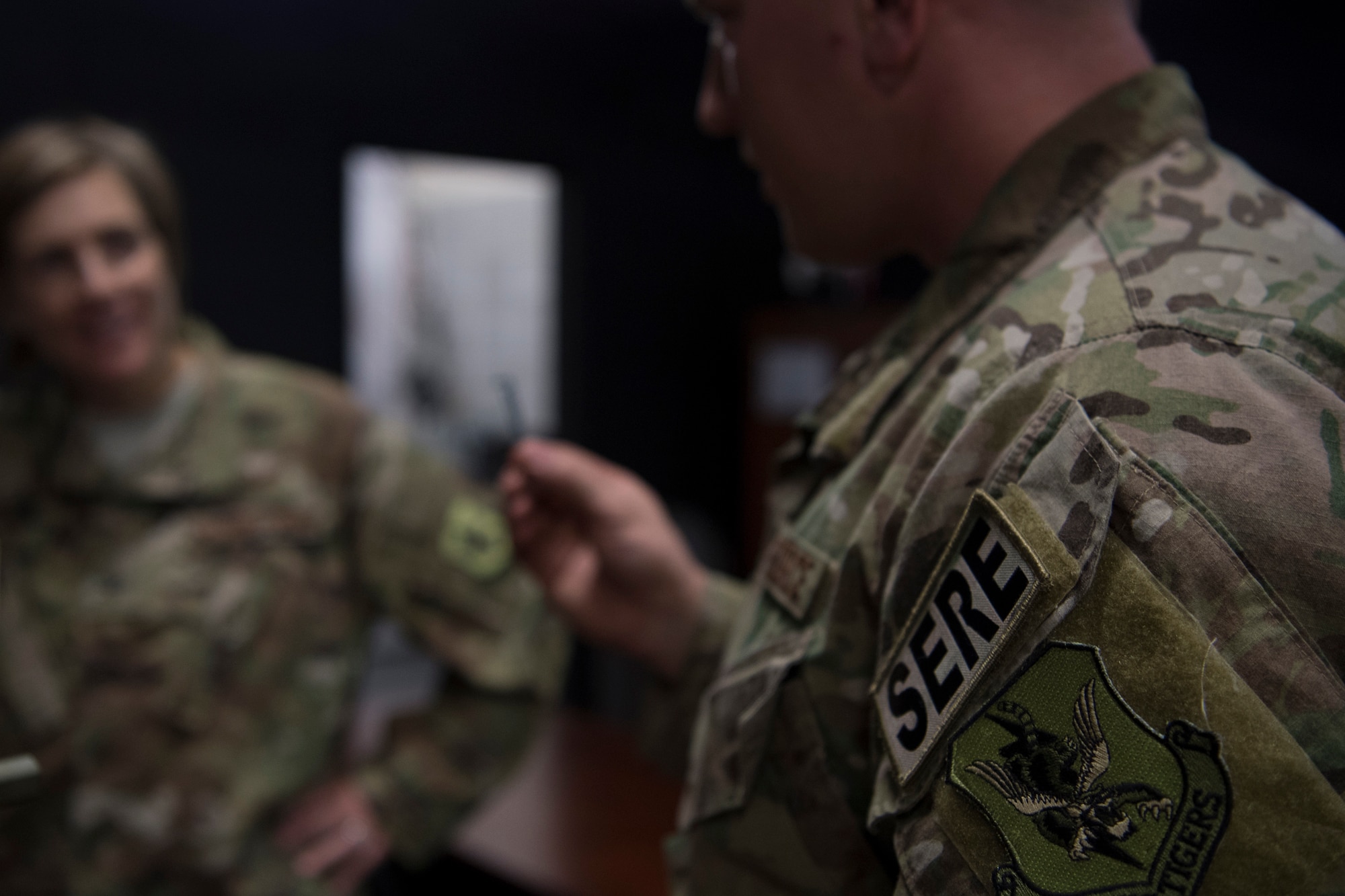 Tech. Sgt. Travis, 347th Operations Support Squadron NCO in charge of Survival, Evasion, Resistance and Escape (SERE) training, briefs Col. Jennifer Short, 23d Wing commander, on training tools and techniques during a 347th Rescue Group immersion, Feb. 26, 2018, at Moody Air Force Base, Ga. (U.S. Air Force photo by Senior Airman Daniel Snider)