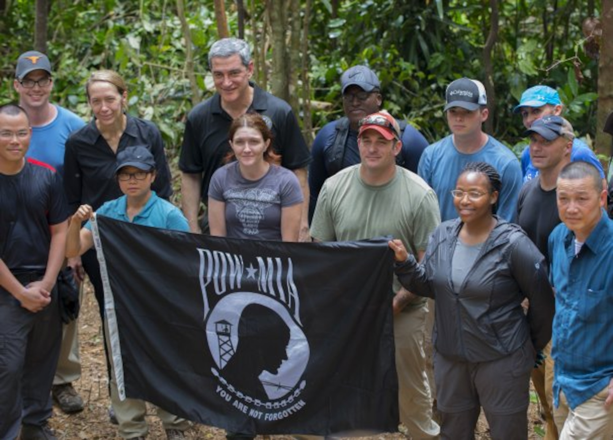 Kelly McKeague, director of the Defense POW/MIA Accounting Agency, left center in the second row, poses for a photograph with recovery team members March 17, 2018, at a site in Quang Ngai province, Vietnam, where an American pilot crashed during the Vietnam War. Air Force Senior Airman Tycoria Johnson, second from right in the first row, followed in the footsteps of her father, Army Sgt. 1st Class Tommy Murphy, who was killed along with other DPAA members in a helicopter crash in Vietnam in 2001. (U.S. Army photo by Sean Kimmons)