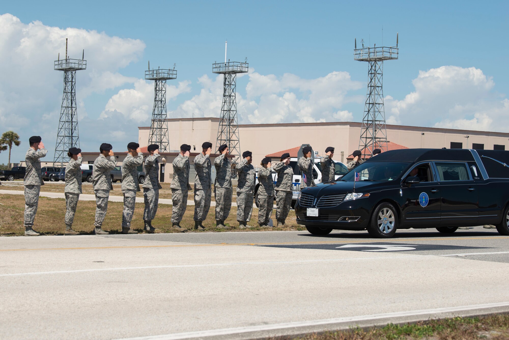 The Patrick Air Force Base community came out in full force to honor Master Sgt. William Posch upon his dignified arrival and transfer at Patrick Air Force Base, Florida April 4. He was killed in a helicopter crash last month in Iraq. Both civilian and military personnel stood shoulder-to-shoulder lining the streets during Posch's dignified transfer to honor an American hero and his family for their ultimate sacrifice. As his motorcade passed by, those in uniform rendered a salute while civilians placed their hand over their heart. (U.S. Air Force photo)