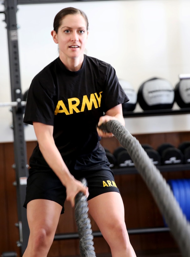 An intelligence officer assigned to the Joint Multinational Readiness Center in Hohenfels, Germany, demonstrates proper technique for working the ropes.