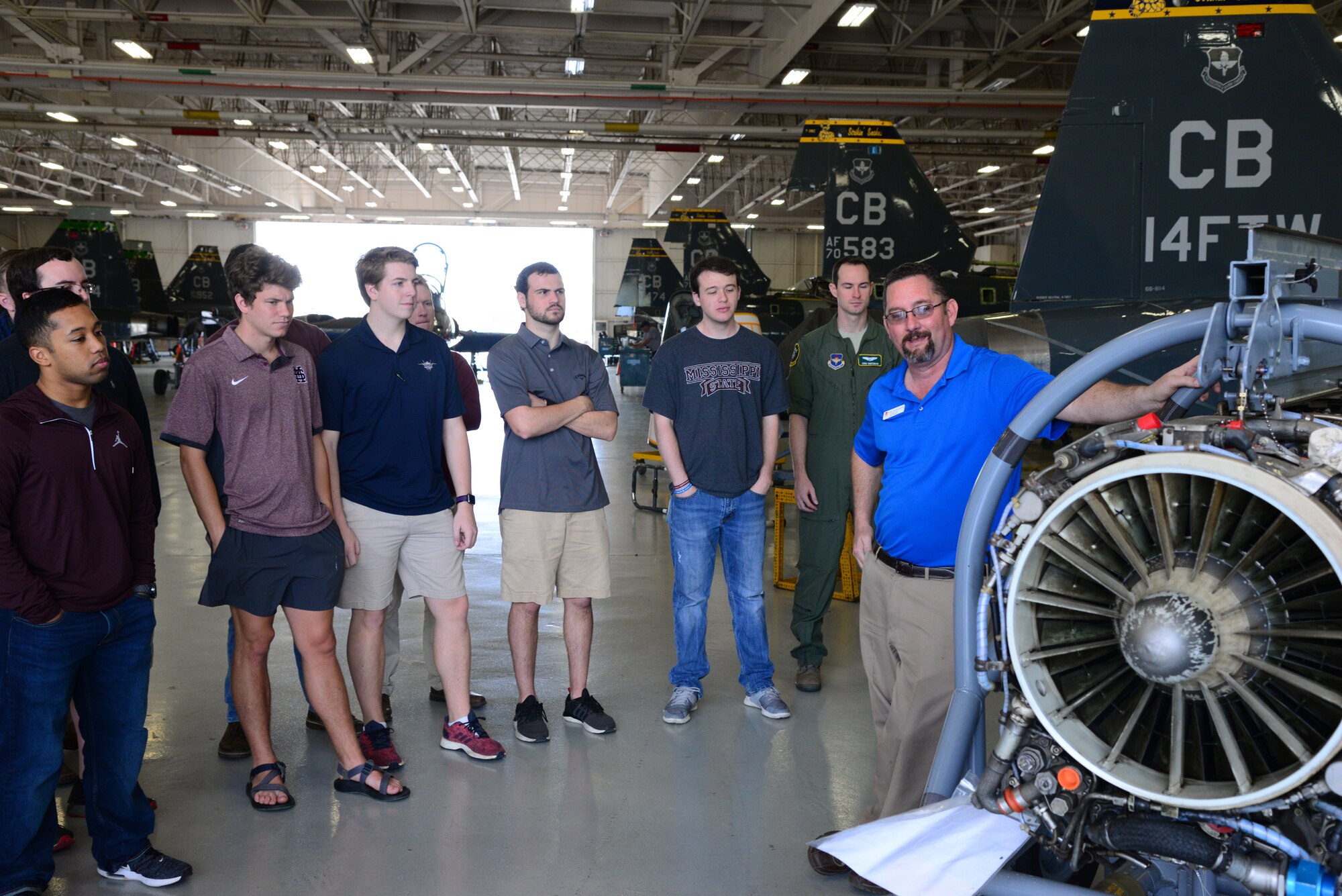 Charles Hill, L3 Communications T-38C Talon foreman, talks with the Mississippi State University Aircraft Propulsion Class about a T-38 engine April 4, 2018, on Columbus Air Force Base, Mississippi. The students visited the 14th Operations Group aircraft simulators, BLAZE Hangar and the L3 Propulsion Lab. (U.S. Air Force photo by Airman 1st Class Beaux Hebert)