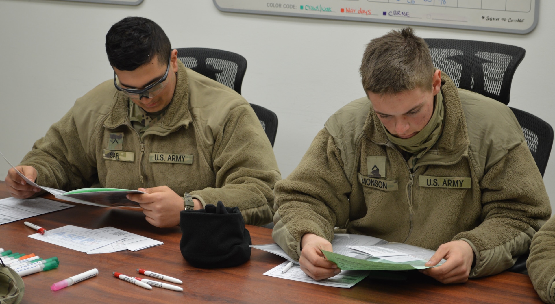 Army Pvts. Joshua Monson and Rami Safi review the blood donor information before donating. Both soldiers are completing training at the Joint Base San Antonio-Camp Bullis Soldier Medic Training Site and volunteered to donate blood.