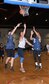 John Bone, a forward on the 20th Intelligence Squadron basketball team and a major with the 55th Wing Judge Advocate office, makes a layup while two defenders from the 595th Aircraft Maintenance Squadron try and stop him during the 2018 Offutt Intramural Basketball championship at the Offutt Field House April 5. Bone led all scorers with 25 in the title game. (U.S. Air Force photo by Charles Haymond)