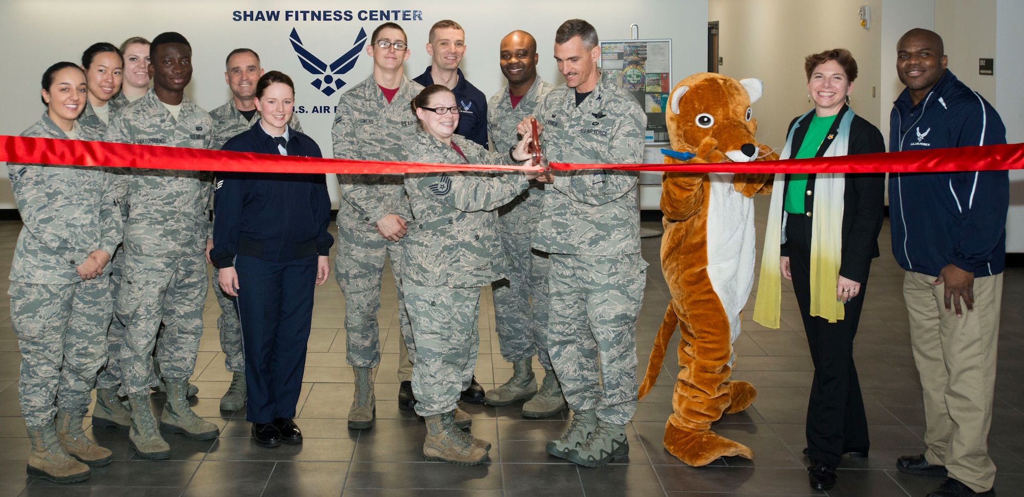 Team Shaw Airmen cut a ribbon at the 20th Force Support Squadron main fitness center at Shaw Air Force Base, S.C., March 30, 2018.