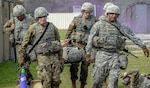 Students in the U.S. Army Medical Department Center and School Basic Officer Leader Course, or BOLC, carry a “wounded” Soldier on a stretcher during a simulated enemy attack as part of their field training Feb. 26 at Joint Base San Antonio-Camp Bullis. BOLC is the entry-level course for students who are becoming commissioned officers in the Army and is conducted in two phases over seven weeks, including classroom training and field training. The objective of the course is to train new officers in Army tasks and familiarize them with the AMEDD culture.