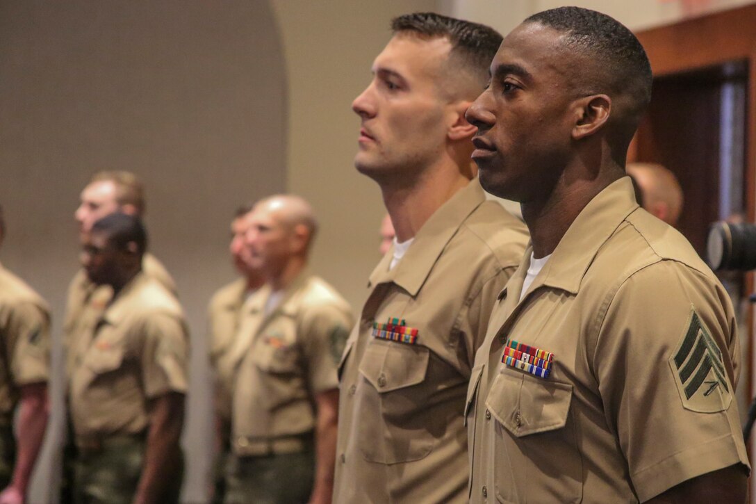 Sergeant Francis Frazier, right, the 38th Color Sergeant of the Marine Corps, and his predecessor Sgt. Kenneth Newton, prepare to execute a relief and appointment ceremony, symbolizing the passing of duties and responsibilities as the senior sergeant of the Marine Corps at Marine Barracks Washington, April 6, 2018. The Color Sergeant of the Marine Corps is entrusted with carrying the National Ensign in ceremonies throughout the National Capitol Region and across the nation. The Color Sergeant leads the official Color Guard Platoon at MBW and is responsible for training and preparing the Marines for future service in the operating forces. (Official Marine Corps photo by Cpl. Damon Mclean/Released)
