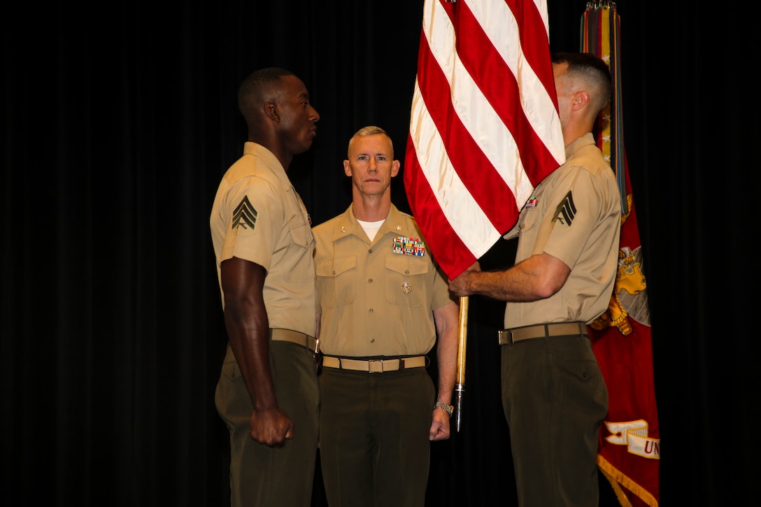 Colonel Tyler J. Zagurski, center, commanding officer, Marine Barracks Washington D.C., oversees a relief and appointment ceremony for the Color Sergeant of the Marine Corps at the Barracks, April 6, 2018. The Color Sergeant of the Marine Corps serves at the senior Sergeant of the Corps, entrusted with carrying the National Ensign in ceremonies throughout the National Capitol Region and across the nation. The Color Sergeant leads the official Color Guard Platoon at MBW and is responsible for training and preparing the Marines for future service in the operating forces. (Official Marine Corps photo by Cpl. Damon Mclean/Released)