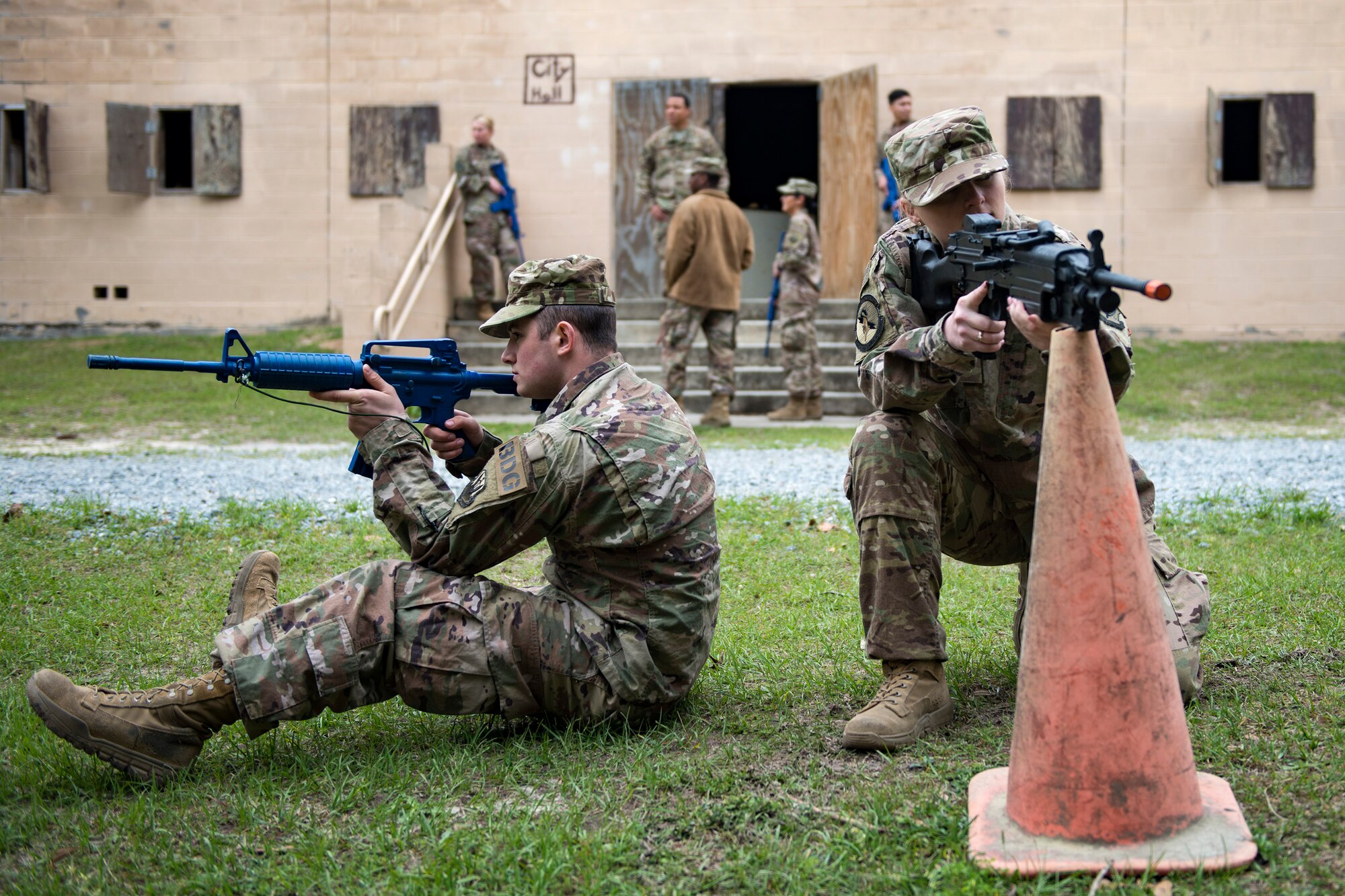 Airman 1st Class Loren Steed, right, and Airman Robert Ward, 824th Base Defense Squadron fire team members, set up perimeter defense during dismounted training operations, March 26, 2018, at Moody Air Force Base, Ga. The operations conducted were a part of the 820th Base Defense Group’s (BDG) Initial Qualification Training, which is given to new Airmen coming into the BDG as an opportunity to learn a baseline of basic combat skills that will be needed to successfully operate as a cohesive unit while in a deployed environment. (U.S. Air Force photo by Airman 1st Class Erick Requadt)