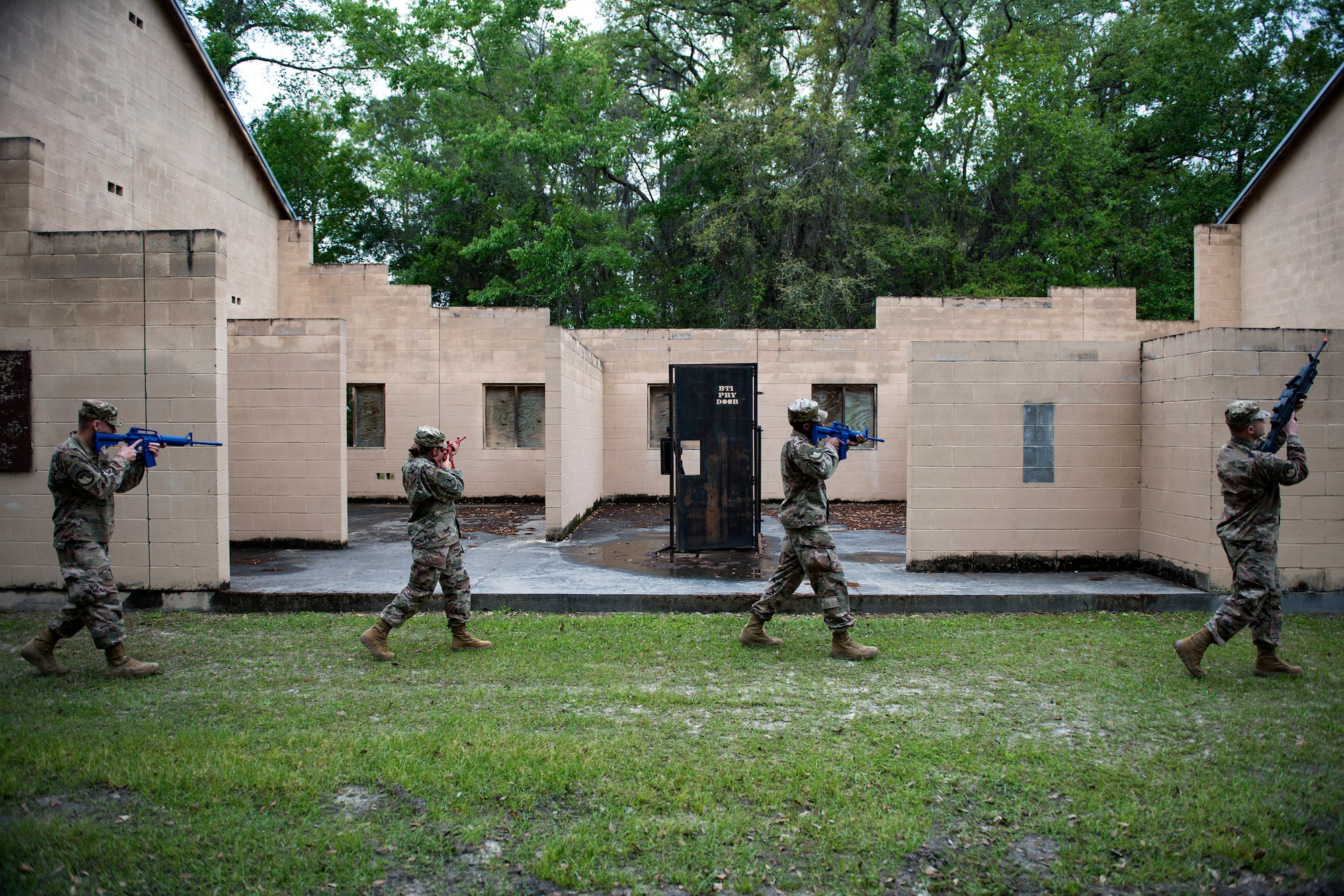 Airmen from the 824th Base Defense Squadron practice staggered formation techniques during dismounted training operations, March 26, 2018, at Moody Air Force Base, Ga. The operations conducted were a part of the 820th Base Defense Group’s (BDG) Initial Qualification Training, which is given to new Airmen coming into the BDG as an opportunity to learn a baseline of basic combat skills that will be needed to successfully operate as a cohesive unit while in a deployed environment. (U.S. Air Force photo by Airman 1st Class Erick Requadt)
