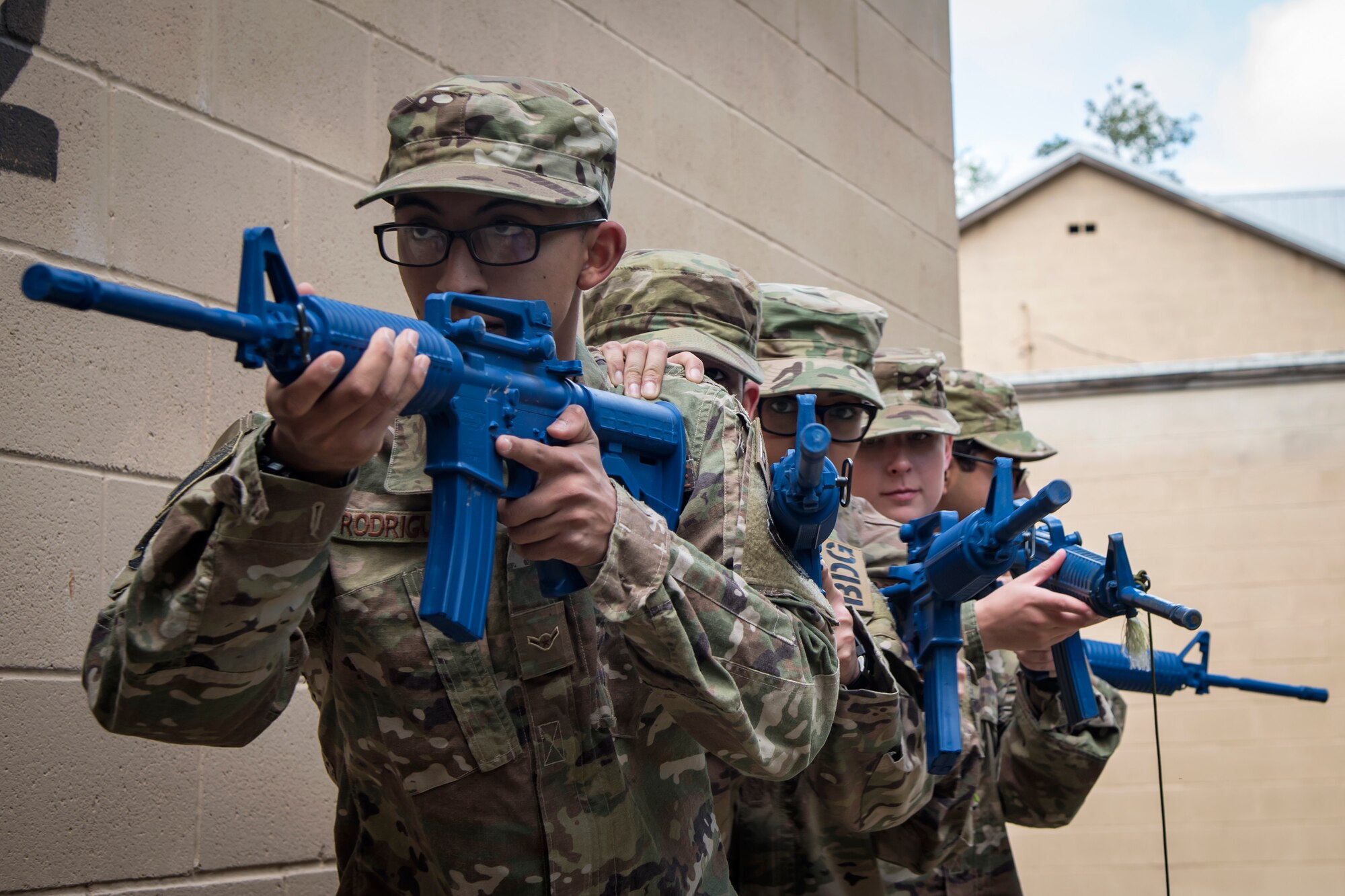 Airmen from the 820th Base Defense Group (BDG), prepare to advance their position during dismounted operations training, March 27, 2018, at Moody Air Force Base, Ga.  The dismounted ops training is part of an Initial Qualification Training, which gives new Airmen coming into the BDG an opportunity to learn a baseline of basic combat skills that will be needed to successfully operate within a cohesive unit while in a deployed environment. (U.S. Air Force photo by Airman Eugene Oliver)