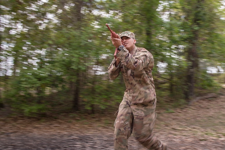 An Airman from the 820th Base Defense Group (BDG) advances his position during dismounted operations training, March 27, 2018, at Moody Air Force Base, Ga.  The dismounted ops training is part of an Initial Qualification Training, which gives new Airmen coming into the BDG an opportunity to learn a baseline of basic combat skills that will be needed to successfully operate within a cohesive unit while in a deployed environment. (U.S. Air Force photo by Airman Eugene Oliver)