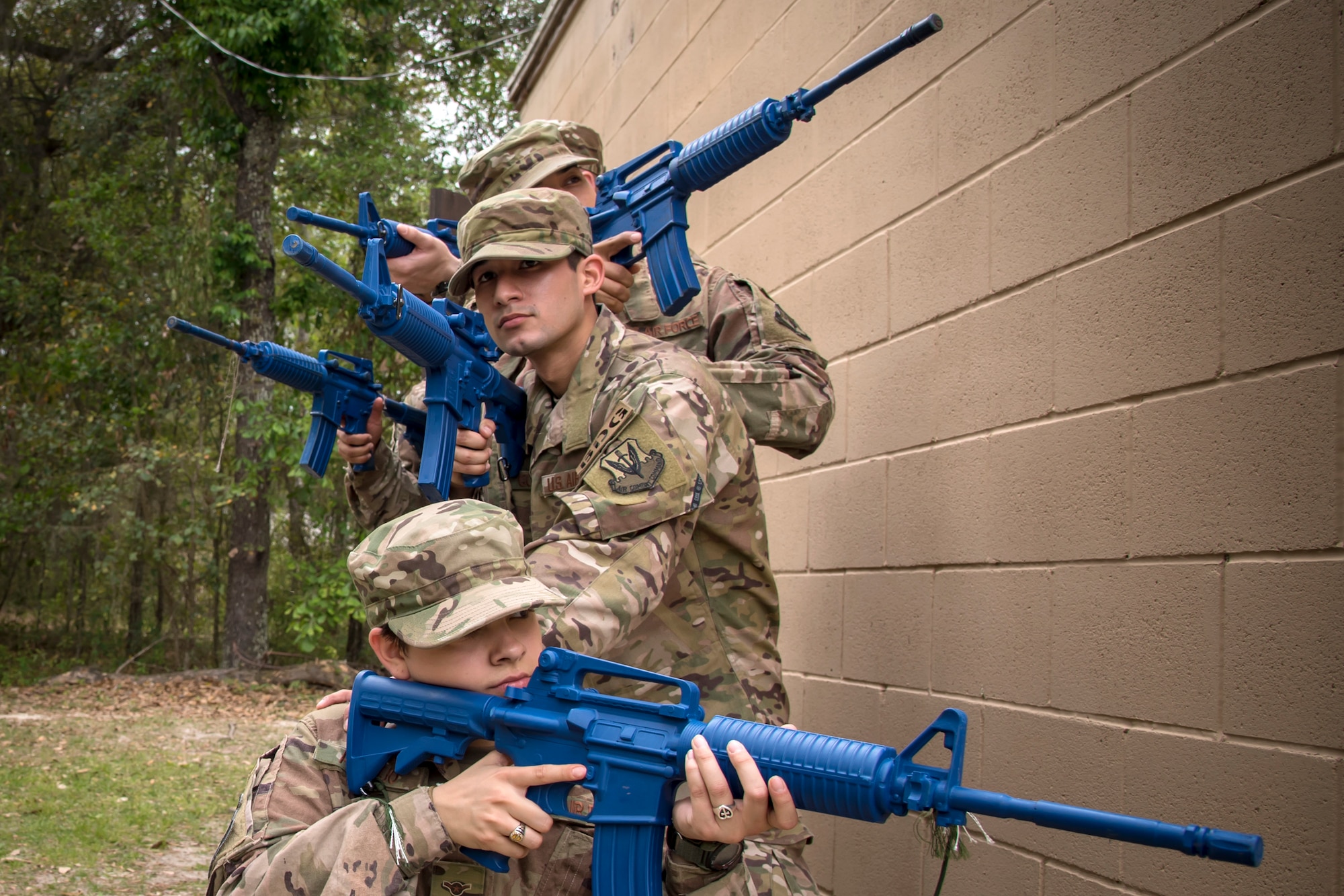 Airmen from the 820th Base Defense Group (BDG), secure their location during dismounted operations training, March 27th, 2018, at Moody Air Force Base, Ga. The dismounted ops training is part of an Initial Qualification Training, which gives new Airmen coming into the BDG an opportunity to learn a baseline of basic combat skills that will be needed to successfully operate within a cohesive unit while in a deployed environment. (U.S. Air Force photo by Airman Eugene Oliver)