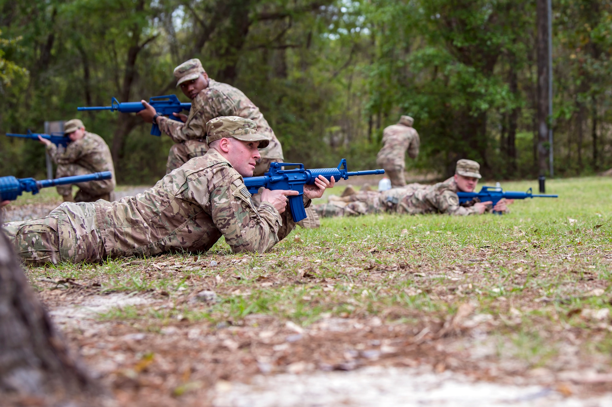 Airman 1st Class Alexander Moore, 824th Base Defense Squadron fireteam member, front, lays in the prone position during dismounted operations training, March 27, 2018, at Moody Air Force Base, Ga. The dismounted ops training is part of an Initial Qualification Training, which gives new Airmen coming into the 820th Base Defense Group an opportunity to learn a baseline of basic combat skills that will be needed to successfully operate within a cohesive unit while in a deployed environment. (U.S. Air Force photo by Airman Eugene Oliver)