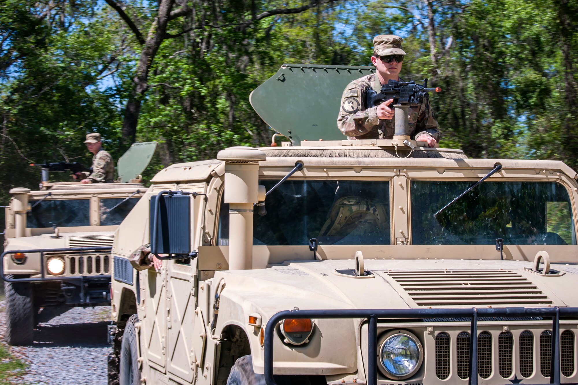 Airmen from 820th Base Defense Group (BDG), ride in a Humvee during vehicle operations training, March 28, 2018, at Moody Air Force Base, Ga. The vehicle ops training is part of Initial Qualification Training, which gives new Airmen coming into the BDG an opportunity to learn a baseline of basic combat skills that will be needed to successfully operate within a cohesive unit while in a deployed environment. (U.S. Air Force photo by Airman Eugene Oliver)