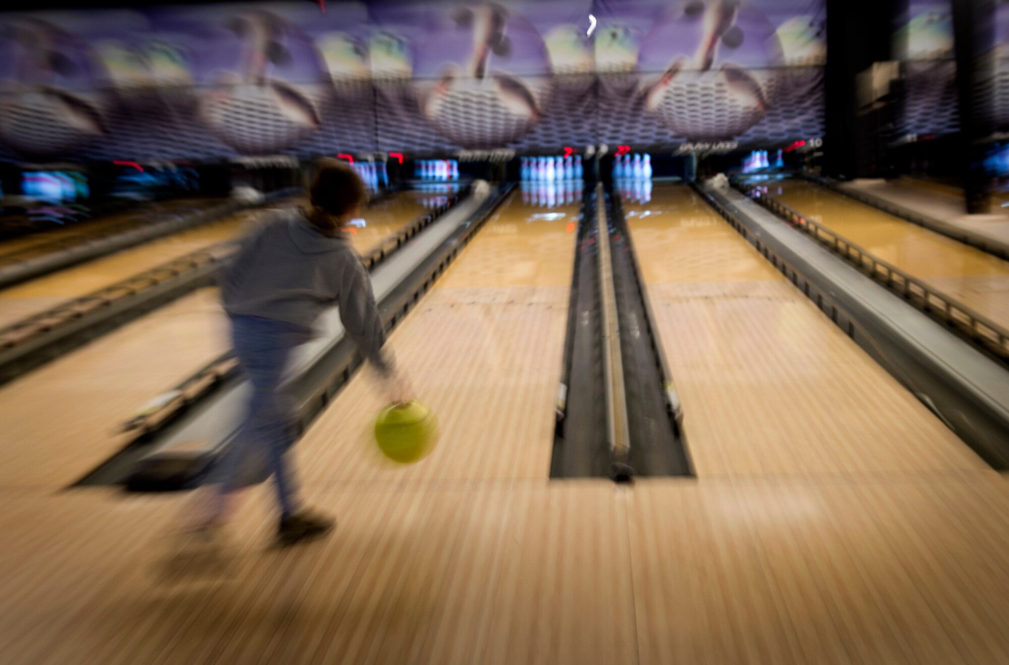 A student from the Altus Air Force Base Youth Center bowls at the Galaxy Grill and Lanes, April 5, 2018, on Altus AFB, Okla.