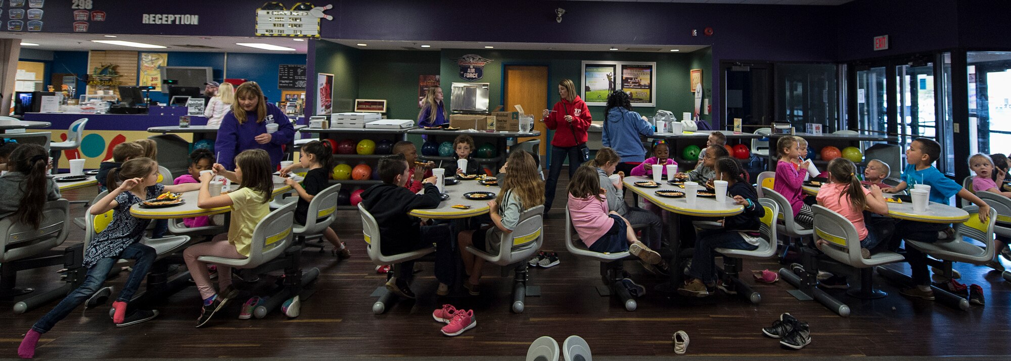 Students from Altus Air Force Base and the local community eat pizza at the Galaxy Grill and Lanes, April 5, 2018, on Altus AFB, Okla.
