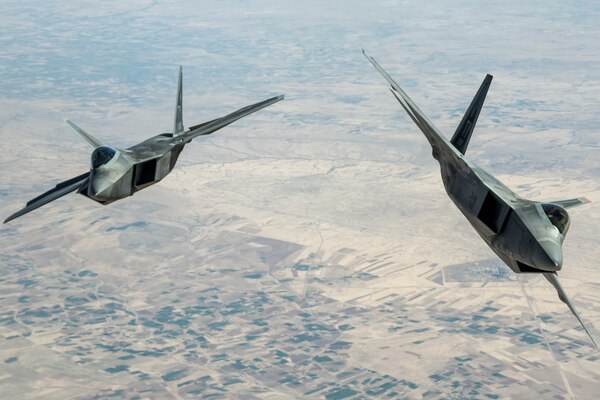 Air Force F-22 Raptors assigned to the 95th Expeditionary Fighter Squadron fly above Syria, March 25, 2018, in support of Operation Inherent Resolve. Air National Guard photo by Staff Sgt. Colton Elliott