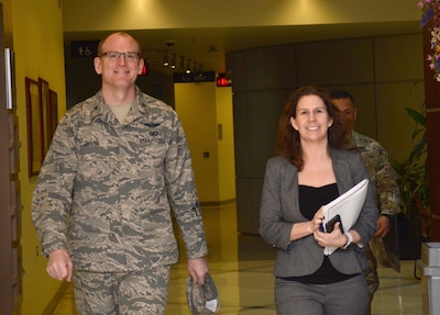 Air Force Brig. Gen. Martin Chapin walks with Rachel Dunlap