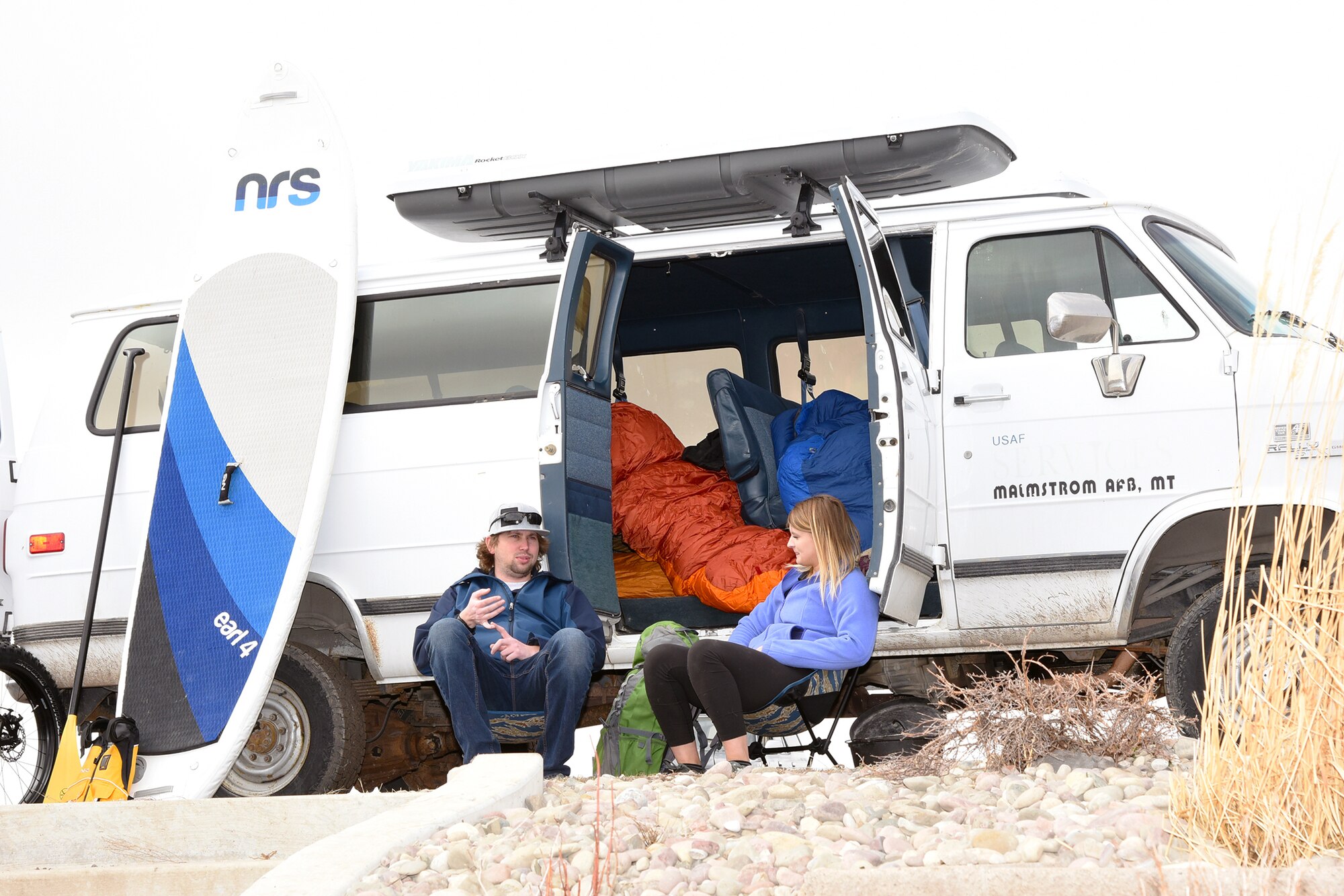 Drew Schlieder and Michaela Klein, 341st Force Support Squadron Outdoor Recreation Center staff, relax at Pow Wow Park April 4, 2018, at Malmstrom Air Force Base, Mont. Malmstrom’s Outdoor Recreation Center staff take active duty and civilian personnel out to see and explore Montana on adventure trips. (U.S. Air Force photo by Kiersten McCutchan)