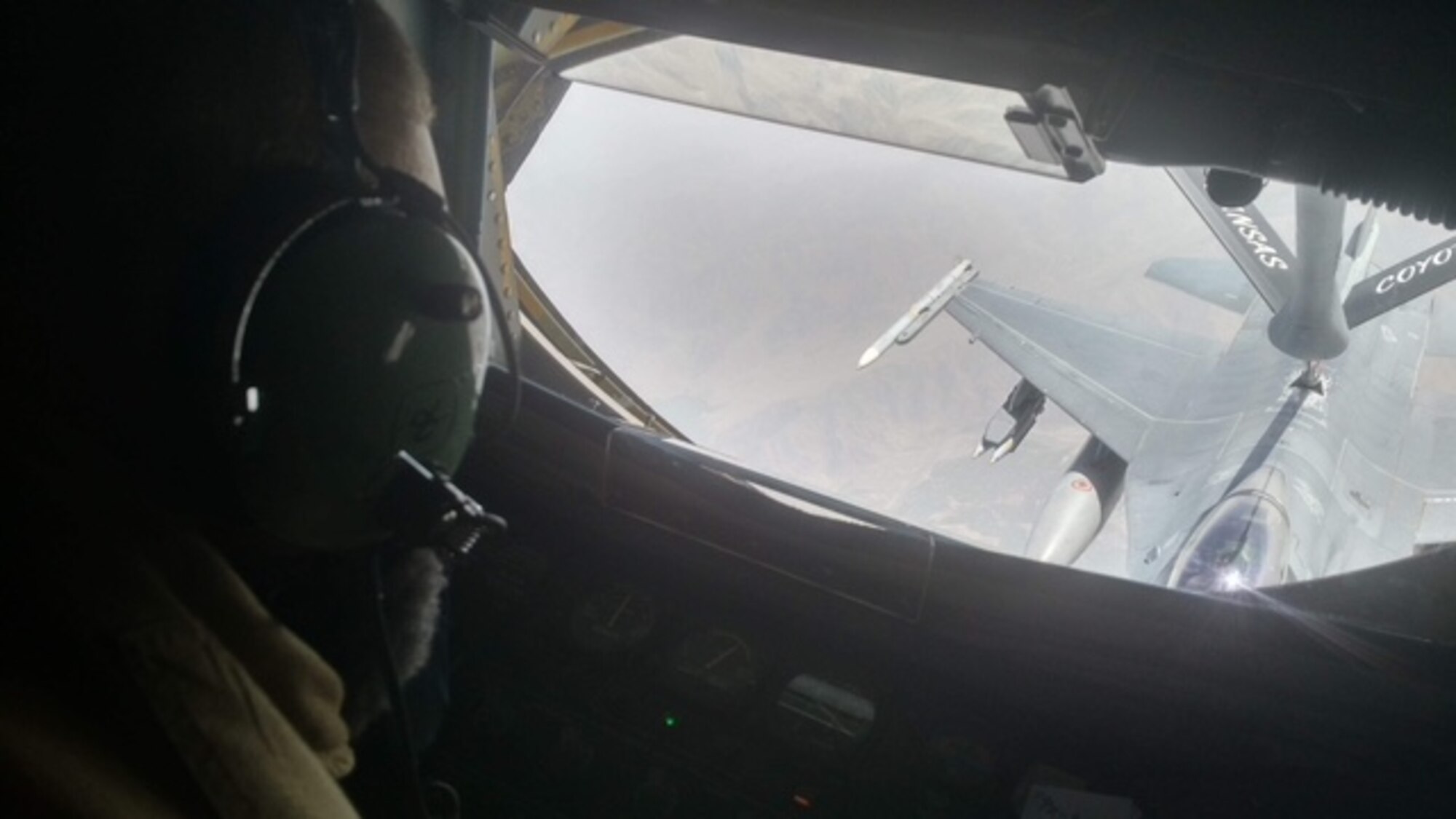 Tech. Sgt. Dwight Miller, 349th Air Refueling Squadron boom operator, refuels an F-16 Fighting Falcon during his 15th deployment as a boom operator with the 379th Air Expeditionary Wing out of Al Udeid Air Base, Qatar. Miller completed his 500th combat mission on his deployment his, during his career Miller has refueled nearly every type of U.S. Air Force aircraft including bombers, cargo and fighters, as well as U.S. Navy, French, British, Germany, Australians, Saudi Arabians and Netherlands fighters. (Courtesy photo)