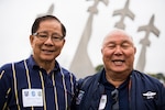 Vietnamese War pilots Chau Trinh and Hai Le War stand in front of the Missing Man Formation Monument, March 13, 2018 at Joint Base San Antonio-Randolph, TX. Both Trinh and Le trained and received their wings at Randolph AFB in 1964. (U.S. Air Force photo by Senior Airman Gwendalyn Smith)