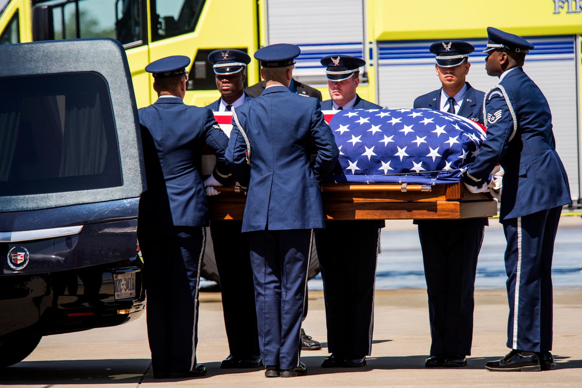 Members of the 4th Fighter Wing honor guard perform a dignified transfer of the repatriated remains of Col. Edgar “Felton” Davis, April 5, 2018, in Raleigh, North Carolina.