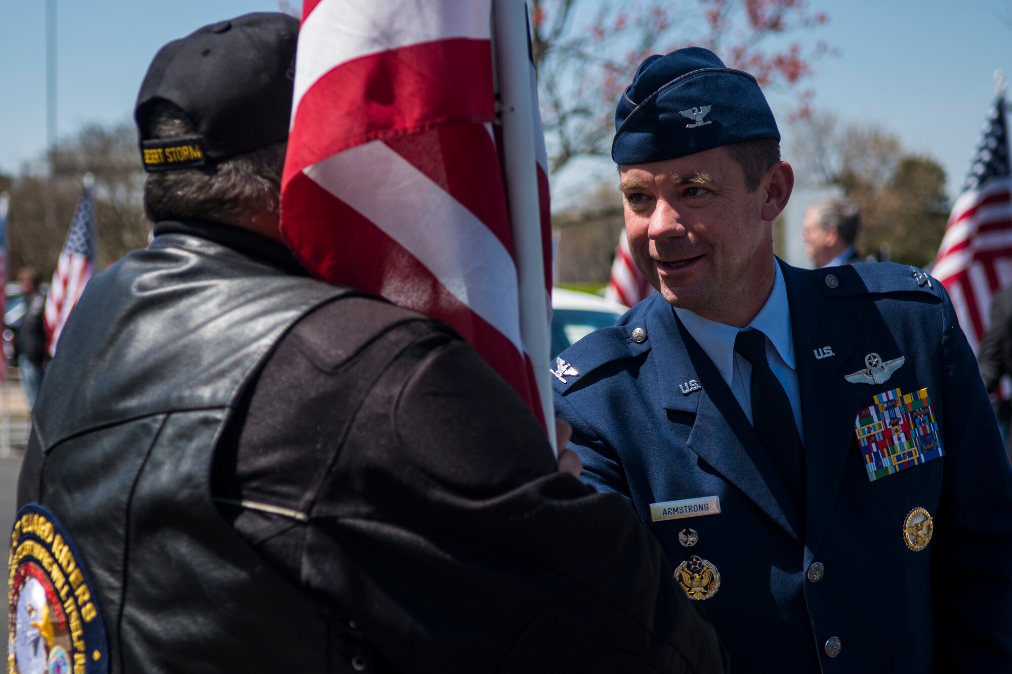 Col. Brian Armstrong, 4th Fighter Wing vice commander, thanks a member of the Patriot Guard Riders of North Carolina, April 5, 2018, in Raleigh, North Carolina.