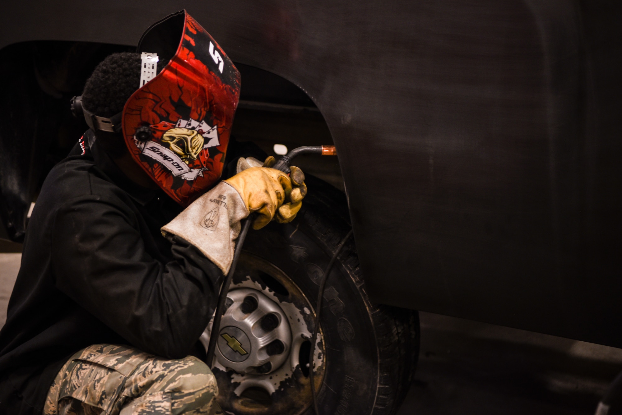 Airmen in the 90th Logistics Readiness Squadron repair a damaged truck before it can be returned to work at F.E. Warren Air Force Base, Wyo., April 6, 2018. 90th LRS is responsible for maintaining and repairing the fleet of vehicles used by the base. Without properly trained Airmen, the process of repairing vehicles would be more time consuming and costly for the Air Force. (U.S. Air Force photo by Airman 1st Class Abbigayle Wagner)