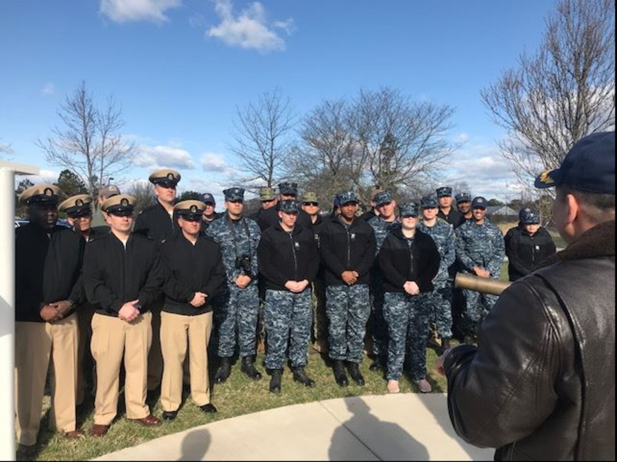U.S. Navy Capt. Muhammad M. Khan, Joint Base McGuire-Dix-Lakehurst deputy commander and Naval Support Activity Lakehurst commander, raises a pennant to honor the unit earning the 2017 Retention Excellence Award at Joint Base MDL, NJ April 5, 2018. NSA Lakehurst had 100 percent retention rate for all first-term Sailors. (Courtesy Photo)