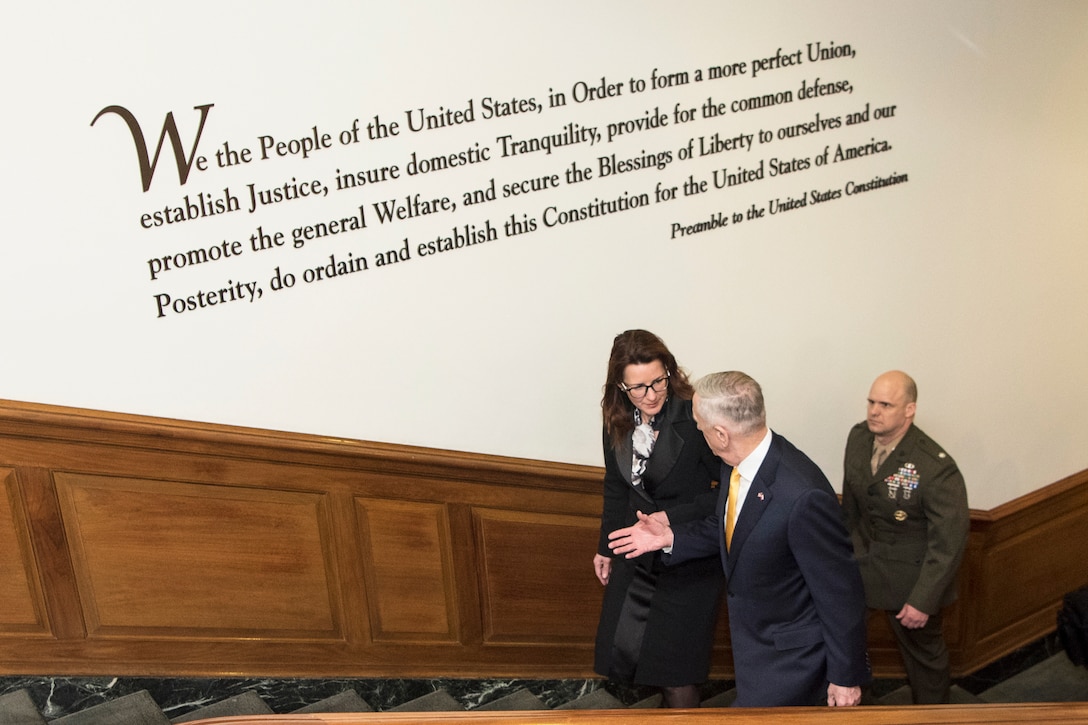 Defense Secretary James N. Mattis and Slovenian Defense Minister Andreja Katič walk up steps in the Pentagon.