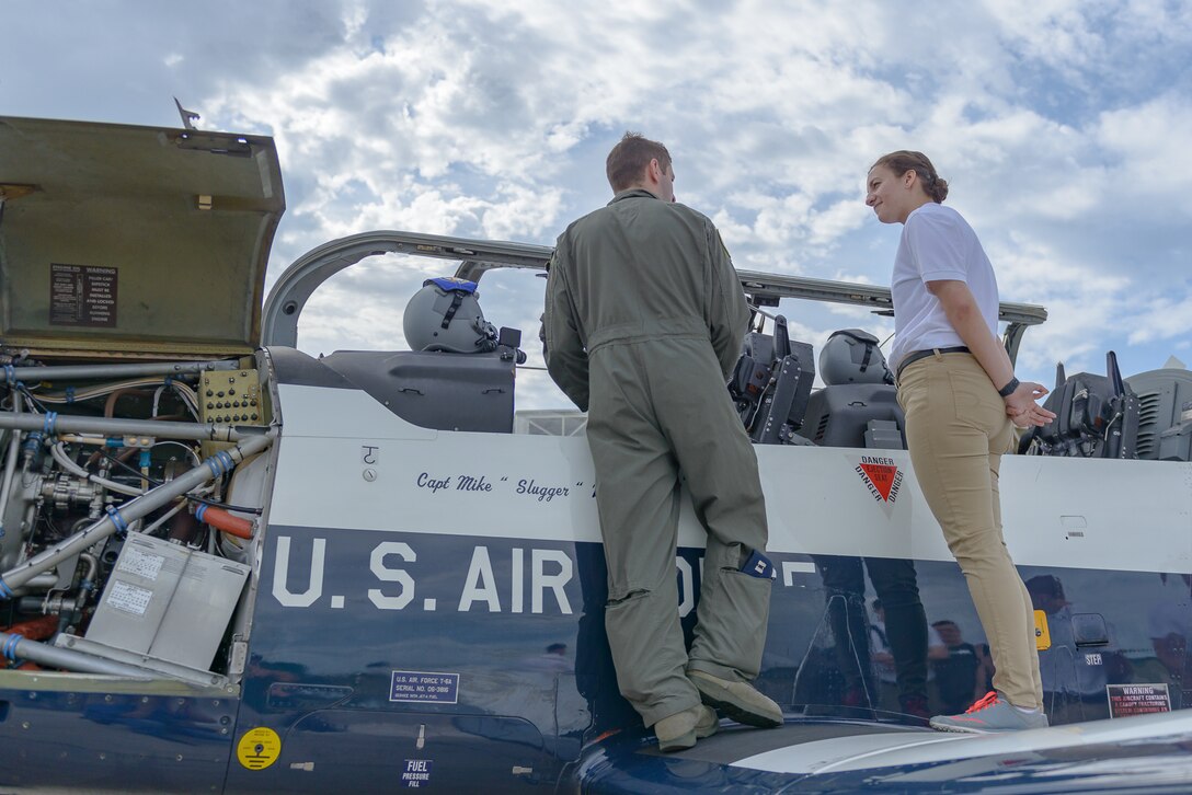 U.S. Air Force Capt. Brett Boudreaux, 14th Flying Training Wing pilot, Columbus Air Force Base, Columbus, Mississippi, talks to Cassandra Richmond, Auburn University Air Force ROTC cadet, during Pathways to Blue April 6, 2018, on Keesler Air Force Base, Mississippi. Cadets received an orientation flight along with hands-on briefings on technical and flying operations in support of the Air Force’s Diversity Strategic Roadmap program. Keesler was home to 280 cadets from 15 universities April 6-7 as part of Pathways to Blue, a diversity outreach event hosted by the 2nd Air Force.  (U.S. Air Force photo by Andre’ Askew)