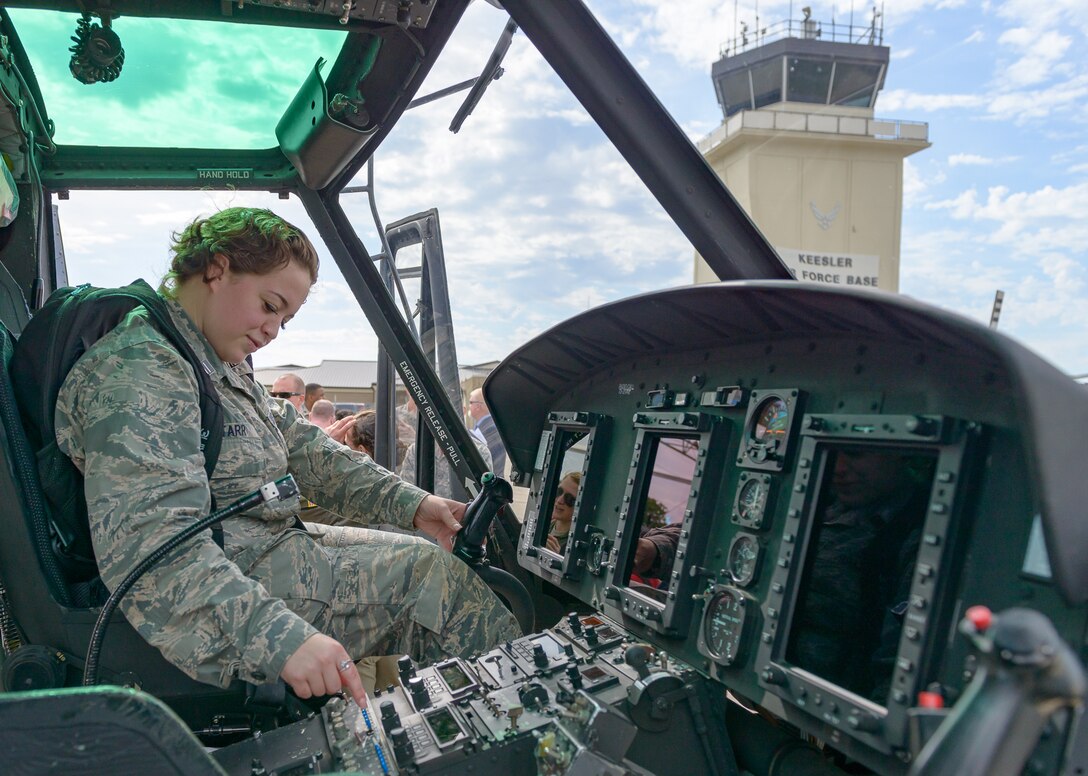 Lindsey Starr, Troy University Air Force ROTC cadet, sits in the pilot seat of a TH-1H helicopter during Pathways to Blue April 6, 2018, on Keesler Air Force Base, Mississippi. Cadets received an orientation flight along with hands-on briefings on technical and flying operations in support of the Air Force’s Diversity Strategic Roadmap program. Keesler was home to 280 cadets from 15 universities April 6-7 as part of Pathways to Blue, a diversity outreach event hosted by the 2nd Air Force.  (U.S. Air Force photo by Andre’ Askew)
