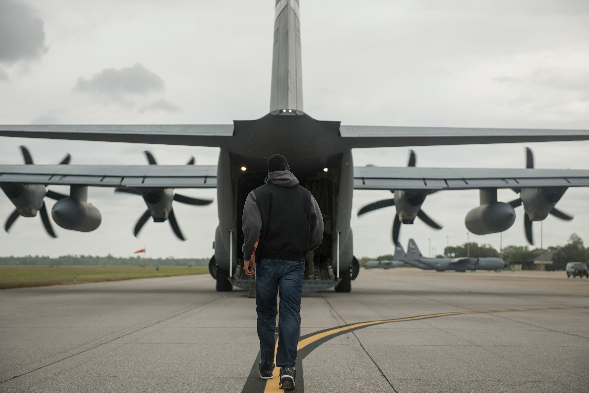A U.S. Air Force ROTC cadet walks toward the back of a MC-130J Commando II for an incentive flight during Pathways to Blue April 6, 2018, on Keesler Air Force Base, Mississippi. Pathways to Blue is a diversity outreach event, hosted by 2nd Air Force with the support of the 81st Training Wing and the 403rd Wing. The event provided more than 280 cadets from 15 different colleges and universities a chance to receive hands-on demonstrations of various career fields. (U.S. Air Force photo by Senior Airman Travis Beihl)