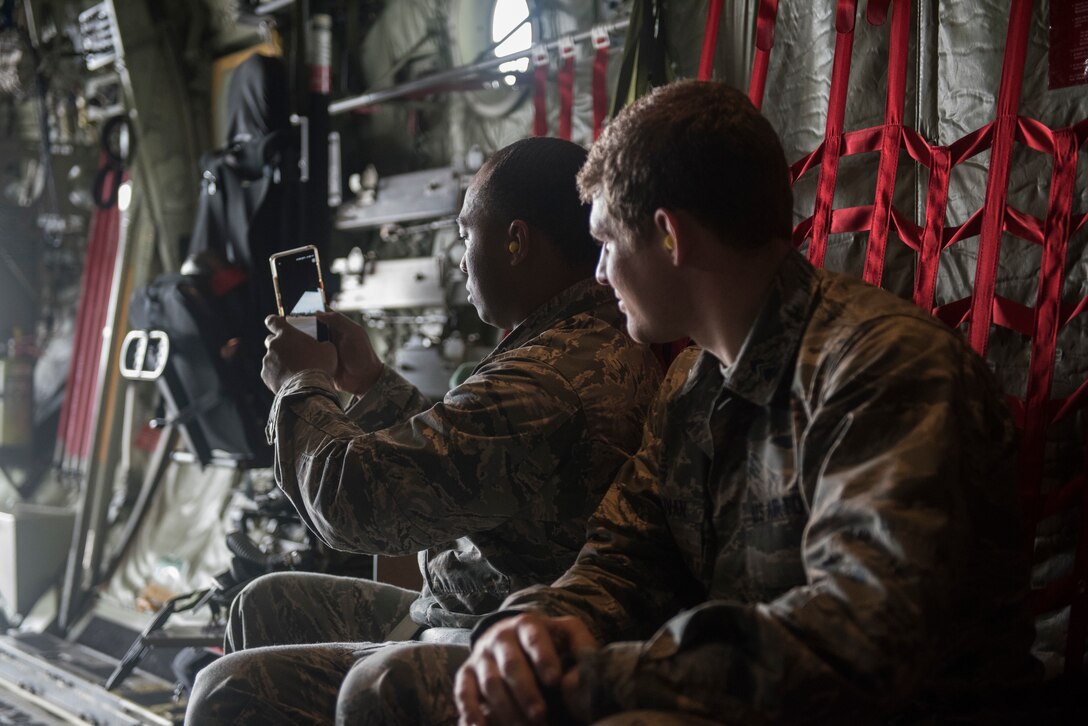 RaShawn Flowers, Troy University Air Force ROTC cadet, takes a picture while seated in a MC-130J Commando II during Pathways to Blue April 6, 2018, on Keesler Air Force Base, Mississippi. Cadets received an orientation flight along with hands-on briefings on technical and flying operations in support of the Air Force’s Diversity Strategic Roadmap program. The event provided more than 280 cadets from 15 different colleges and universities a chance to receive hands-on demonstrations of various career fields. (U.S. Air Force photo by Senior Airman Travis Beihl)