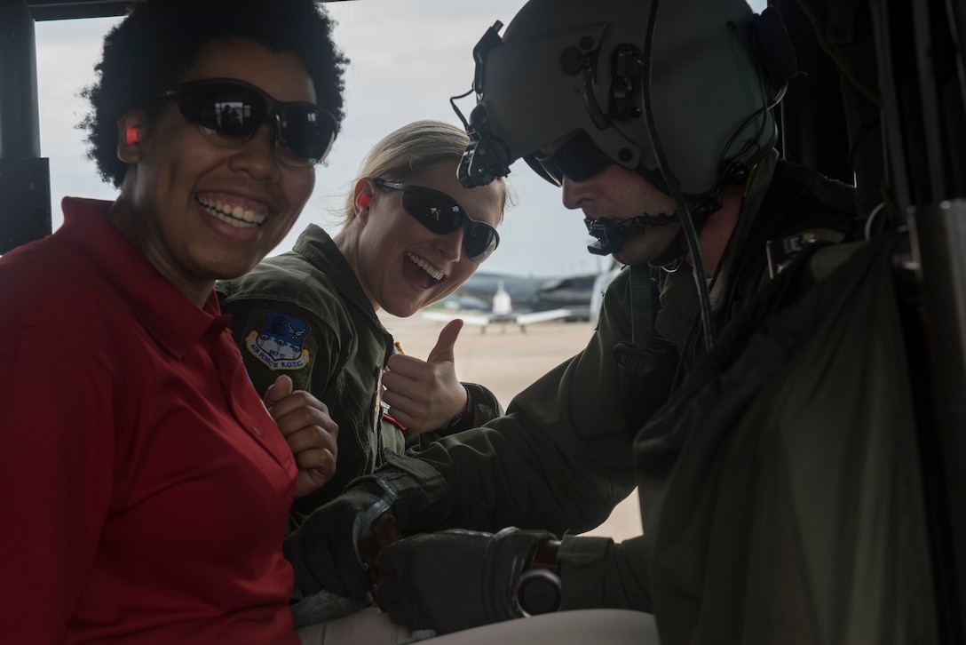 Air Force ROTC Cadets smile before receiving an incentive flight in a TH-1H helicopter during Pathways to Blue April 6, 2018, on Keesler Air Force Base, Mississippi. Throughout the two-day event, ROTC cadets and enlisted personnel traveled through this diverse and inclusive event to better aim themselves to become future Air Force leaders. The event provided more than 280 cadets from 15 different colleges and universities a chance to receive hands-on demonstrations of various career fields. (U.S. Air Force photo by Senior Airman Travis Beihl)