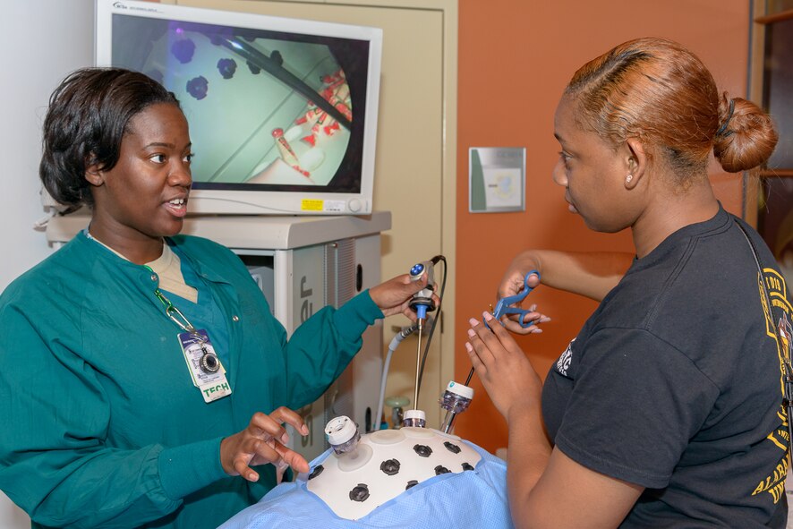 Aliyah Stewart, Alabama State University U.S. Air Force ROTC cadet, receives instructions on laparoscopic surgery procedures during Pathways to Blue at Keesler Air Force Base, Miss., April 6, 2018. The two-day schedule included orientation sessions in science technology engineering and mathematics, operations, and support areas such as cyber, battlefield Airmen, medical, and aircrew flight operations. (U.S. Air Force photo by Andre’ Askew)