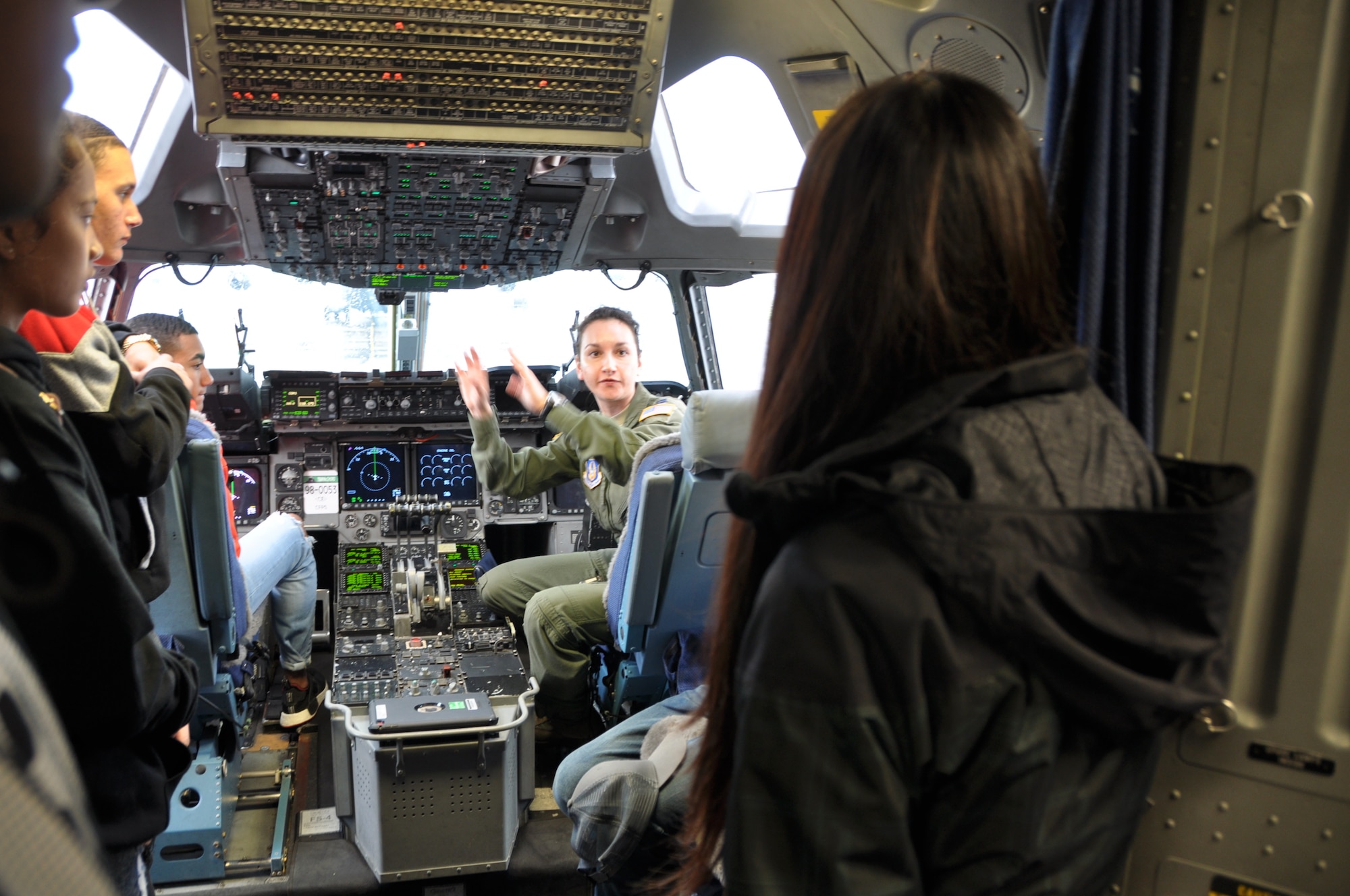 U.S. Air Force Capt. Fidan Thornburg, assigned to the 728th Airlift Squadron tells Reynolds High School Army JROTC cadets the job responsibilities of a C-17 pilot at Joint Base Lewis-McChord on April 7, 2018. (U.S. Air Force by 1st Lt. Alyssa Hudyma)
