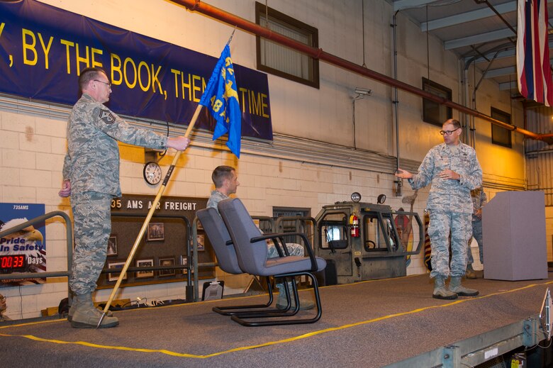 U.S. Air Force Col. Kenneth Lute, 624th Regional Support Group commander, addresses Maj. Kenneth Ruggles Jr. during the 48th Aerial Port Squadron assumption of command ceremony at Joint Base Pearl Harbor-Hickam, Hawaii, April 7, 2018, where Ruggles will become the squadron commander.