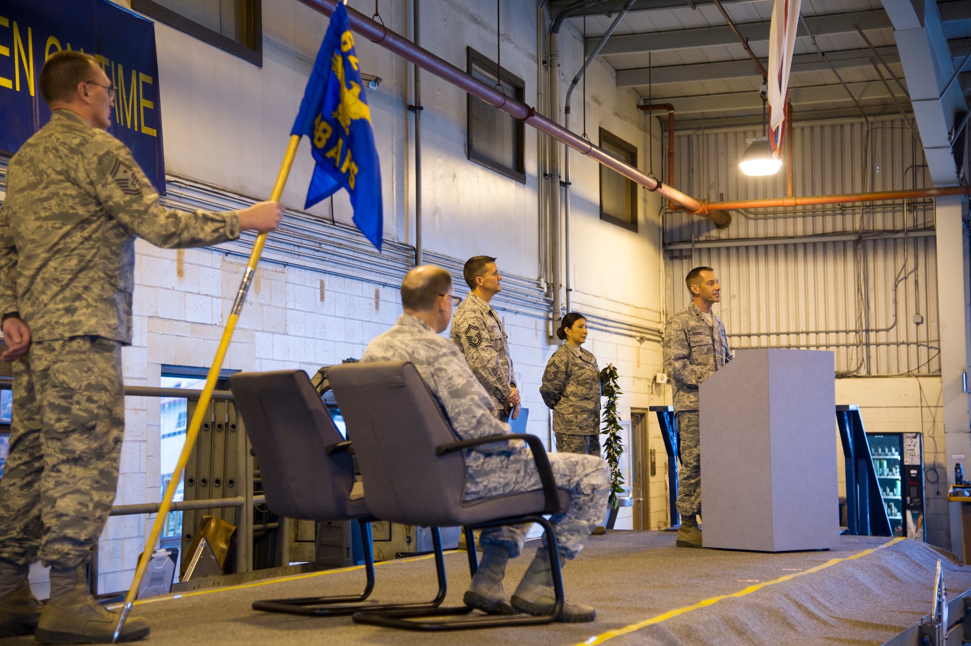 U.S. Air Force Maj. Kenneth Ruggles Jr. addresses guest and members of the 48th Aerial Port Squadron during an assumption of command ceremony at Joint Base Pearl Harbor-Hickam, Hawaii, April 7, 2018, where Ruggles became the 48th APS commander.