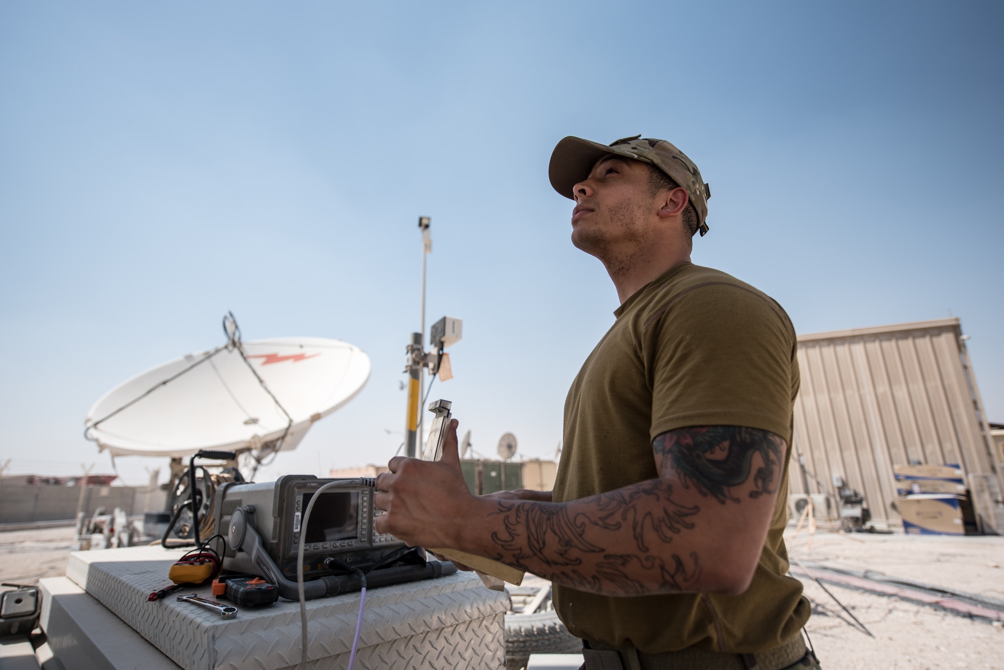 U.S. Air Force Staff Sgt. Joshua Foster, a radio frequency transmissions technician with the 379th Operations Support Squadron, uses a spectrum analyzer to perform diagnostics on a satellite at Al Udeid Air Base, Qatar, Mar. 30, 2018. Silent Sentry protects critical satellite communication links by employing multiple weapons systems for electronic warfare. (U.S. Air National Guard photo by Master Sgt. Phil Speck)